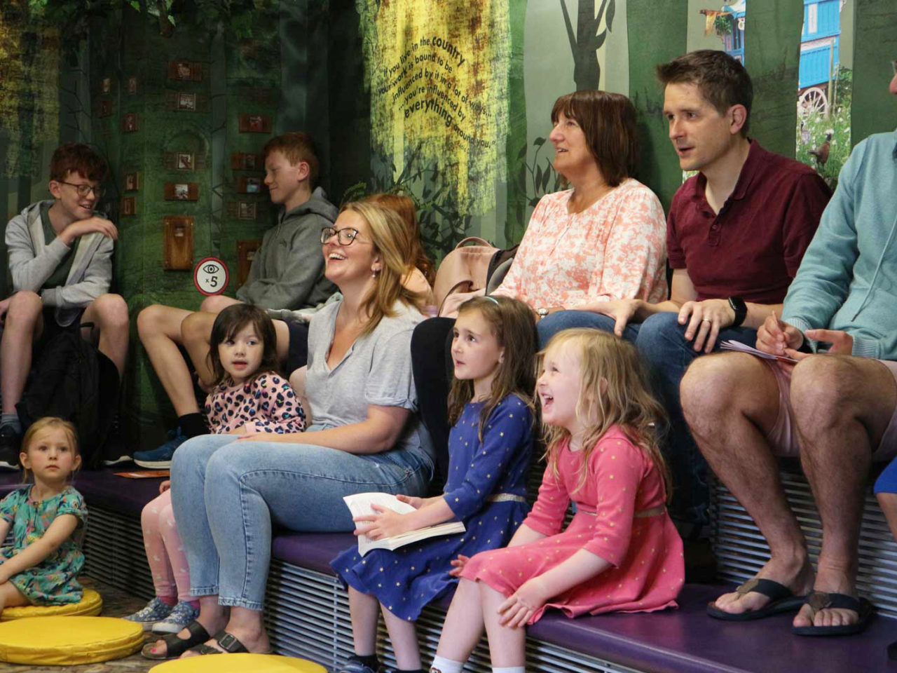 Museum visitors listening to storytelling